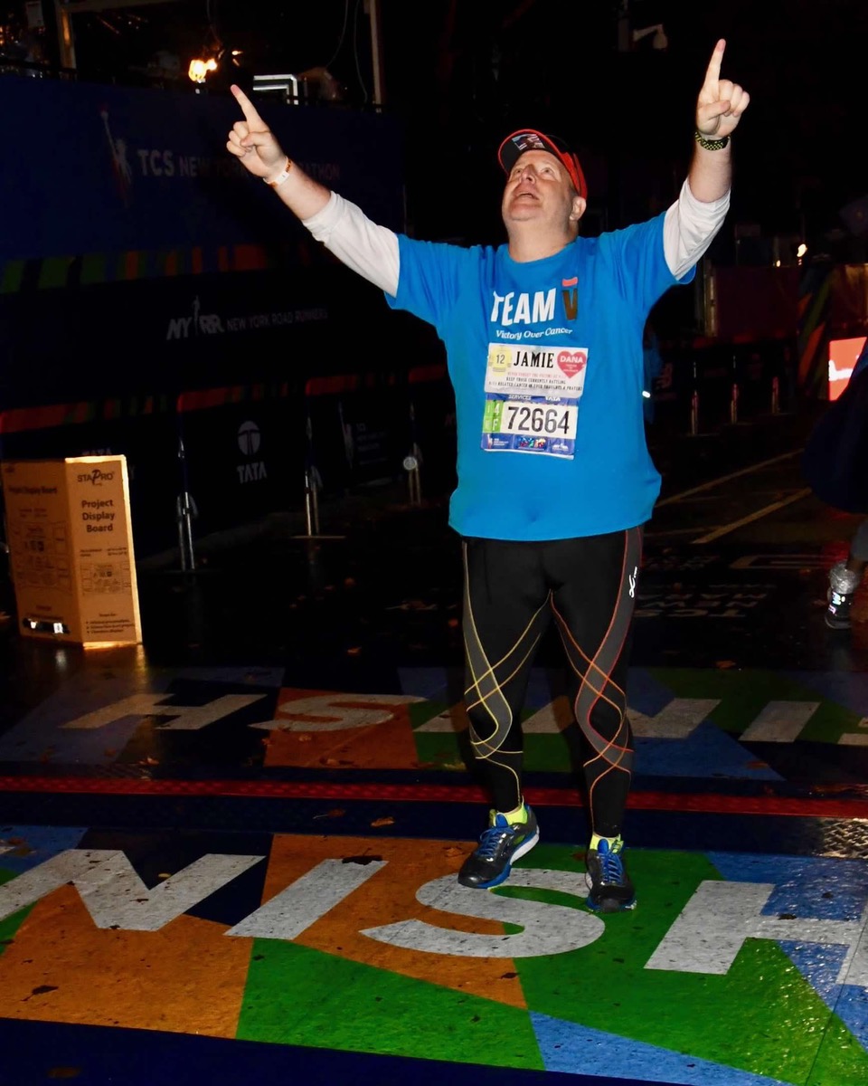 Jamie Lassner crossing the finish line at the TCS New York City Marathon